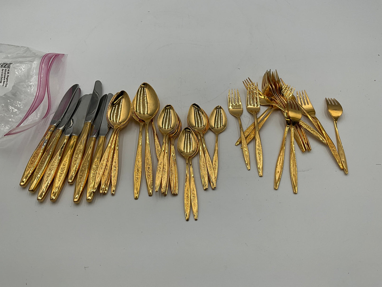 W.M. Rogers Gold Silverware Service for 6 & Extras