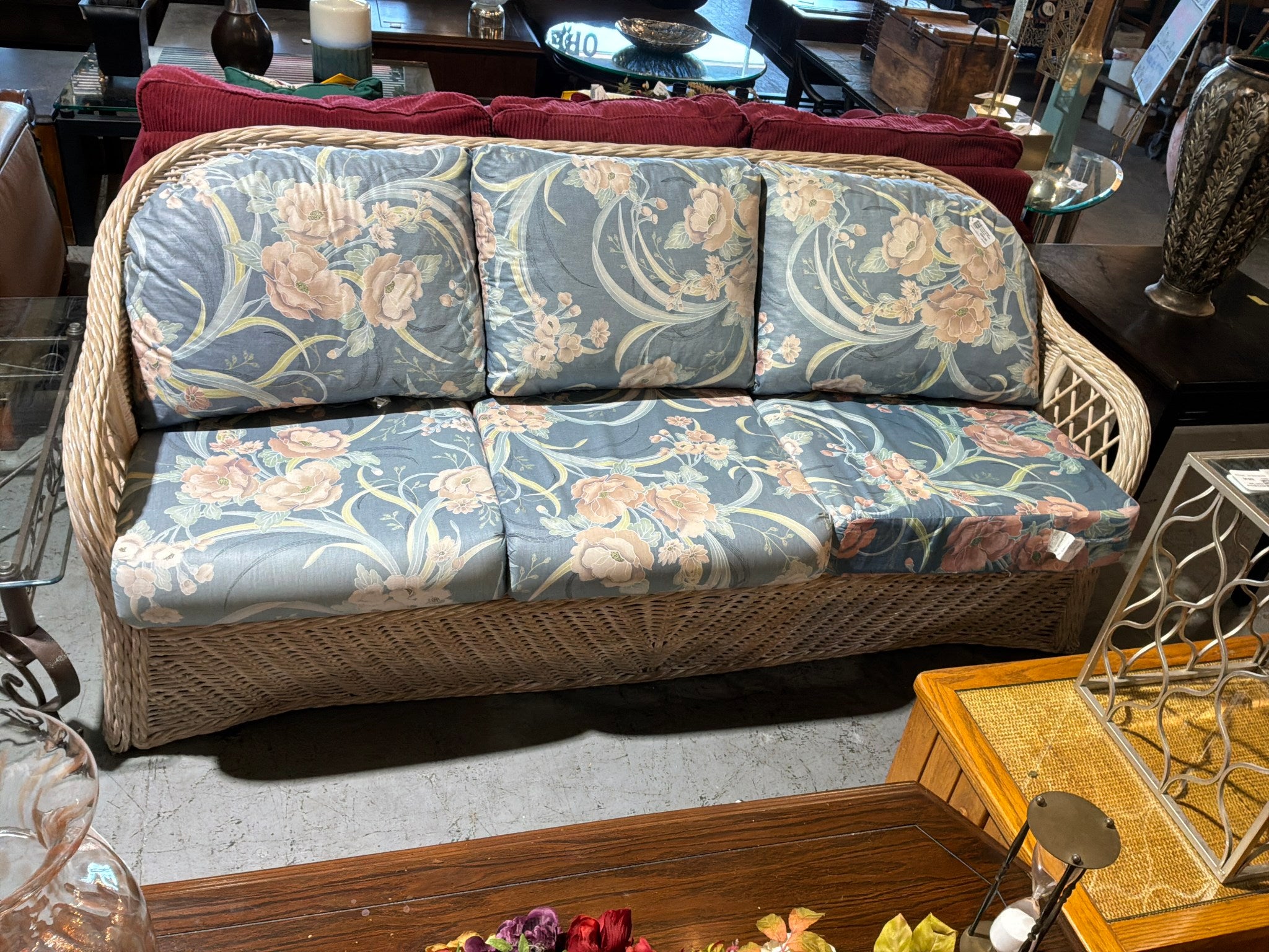 Cream Wicker Couch W/ Floral Cushions