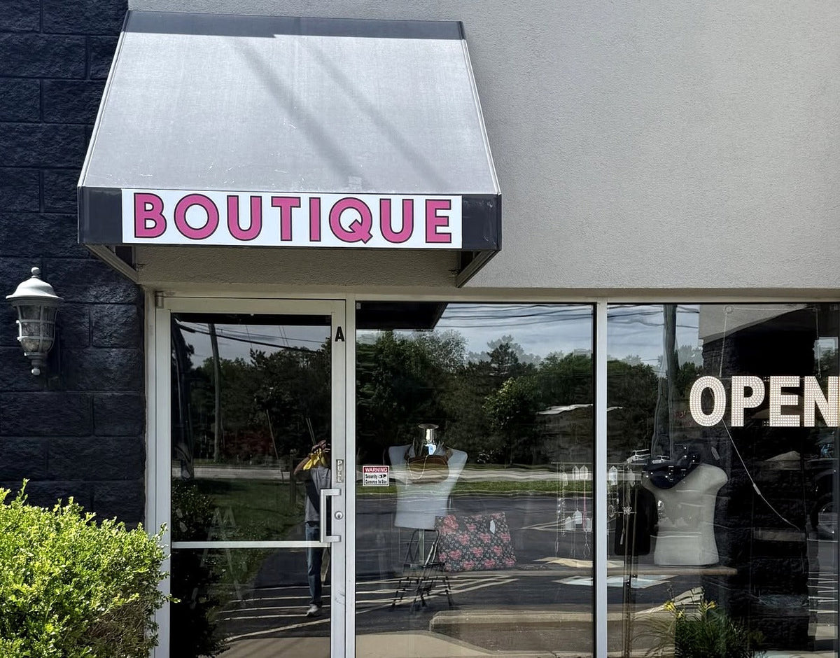 This N That Consignments Boutique storefront in Mason, Ohio, with its pink BOUTIQUE awning