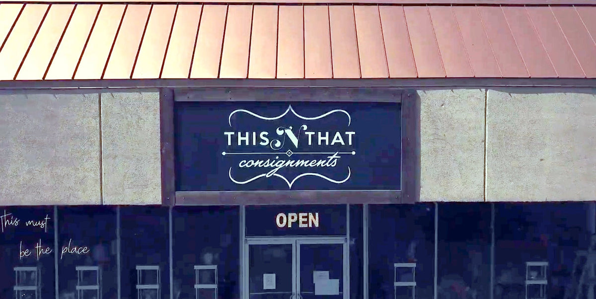 This N That Consignments storefront in Mason, Ohio: sign above the entrance under a copper roof
